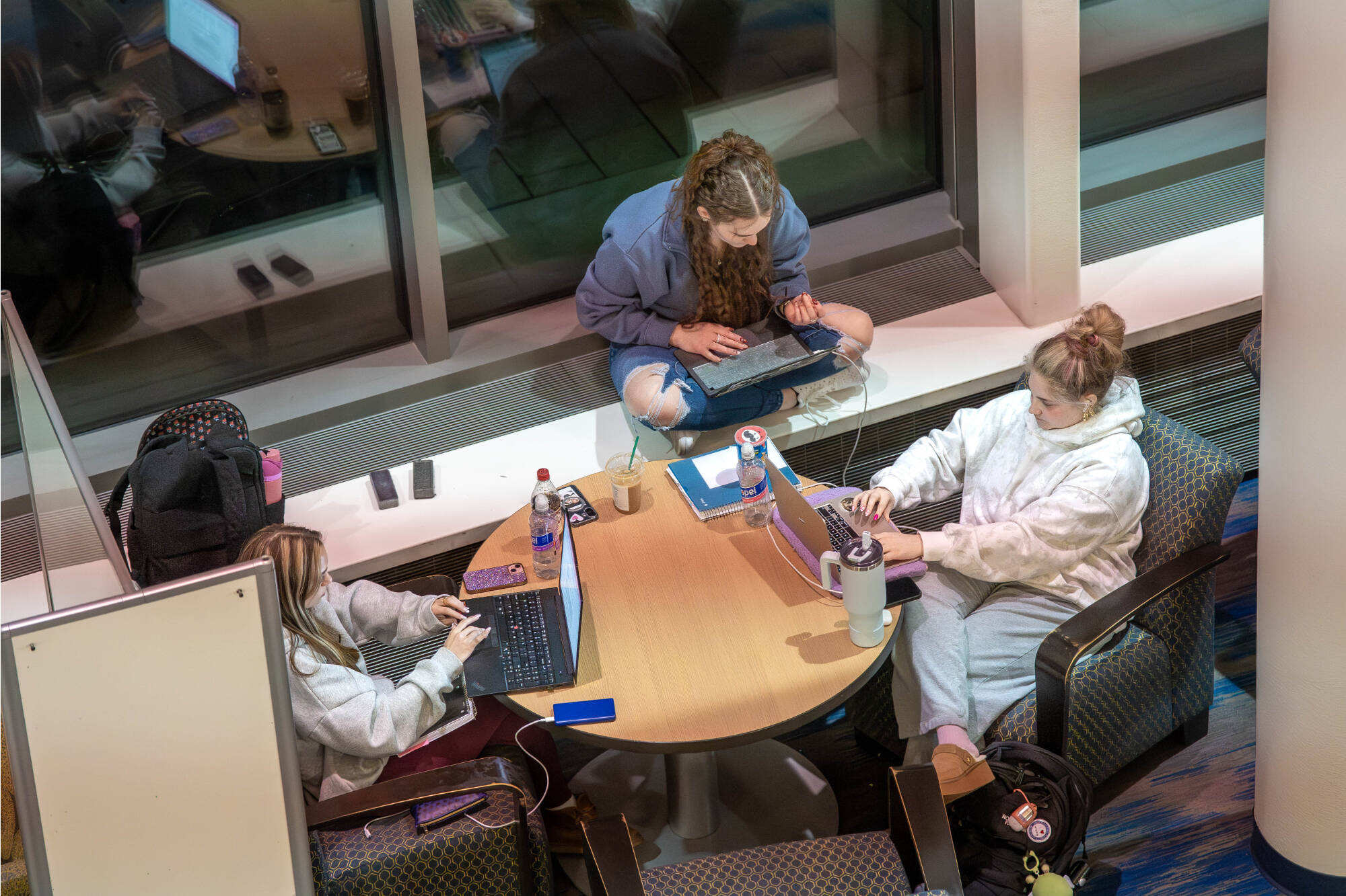 students studying at library